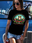 Comfort Colors C1717 black t-shirt with colorful Zen Nootropics frog design, worn by woman with sunglasses and denim shorts outdoors